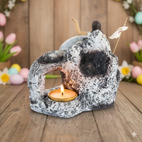 Wykonana z żywicy i metalu, z miejscem na tealight.