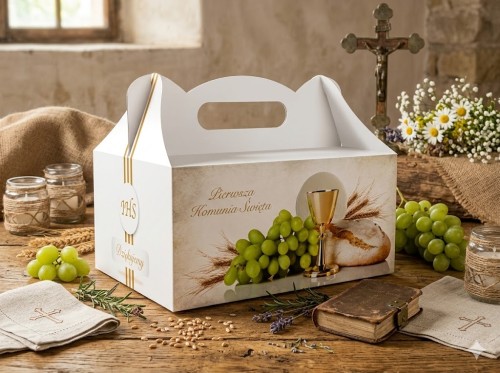 Kartonik z uchwytem ułatwiającym przenoszenie słodkiego upominku.