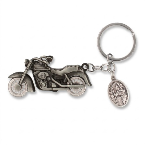 Metalowy brelok w kształcie motocykla z medalikiem św. Krzysztofa.