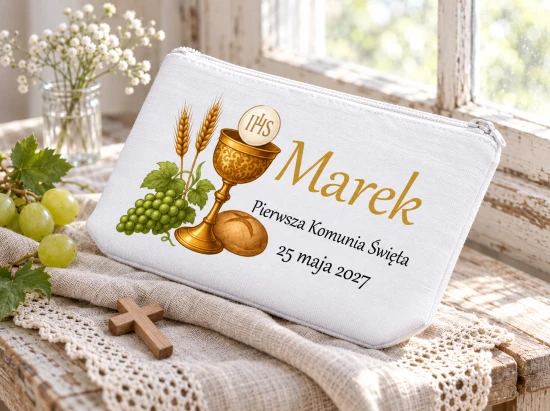 Motyw złotego kielicha, hostii IHS, kłosów, winogron i chleba.
